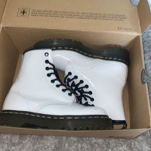 White dr martens boots .